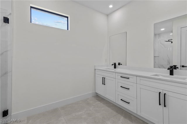 bathroom featuring vanity and an enclosed shower