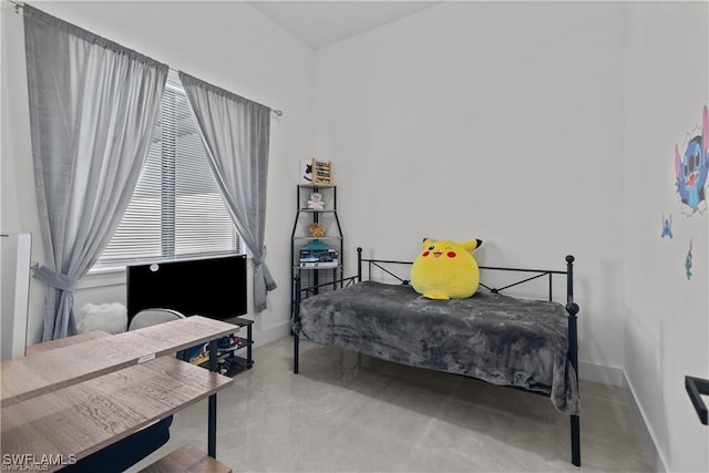 bedroom with concrete flooring