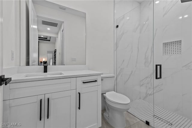 bathroom with vanity, a shower with shower door, and toilet