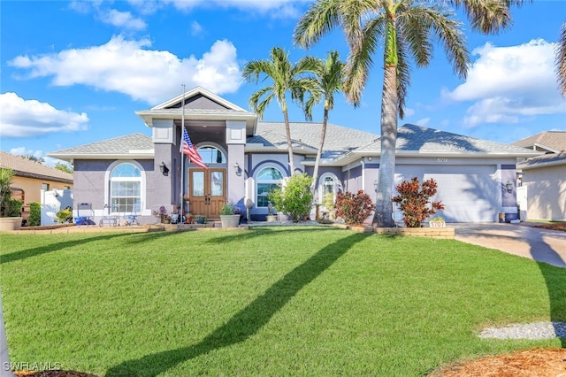 view of front of home featuring a garage and a front yard