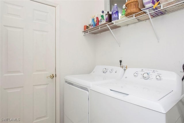 washroom with washer and clothes dryer