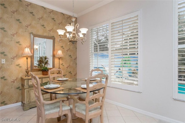 dining space with crown molding, light tile patterned flooring, and an inviting chandelier