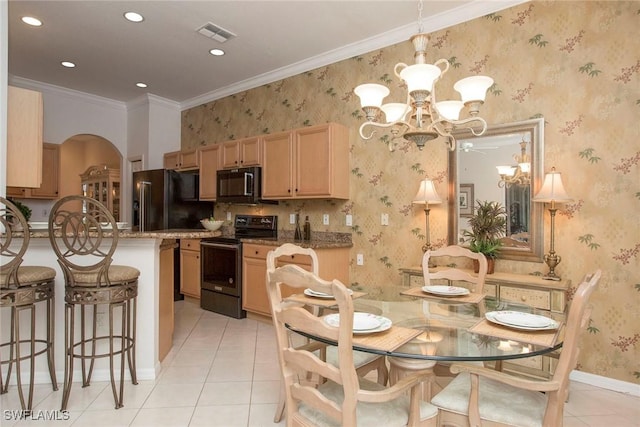 dining room featuring crown molding, a notable chandelier, and light tile patterned floors