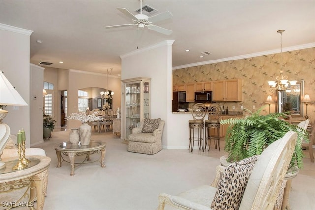 carpeted living room featuring crown molding and ceiling fan with notable chandelier