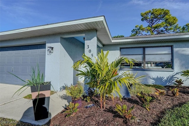 view of property exterior with a garage