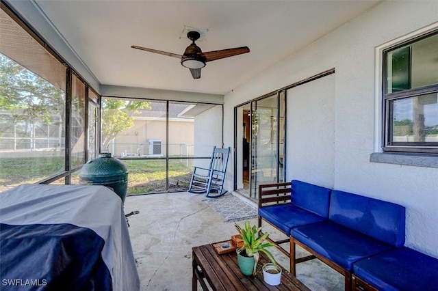 sunroom / solarium with ceiling fan