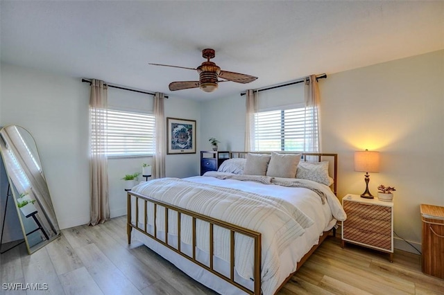 bedroom with light hardwood / wood-style flooring and ceiling fan