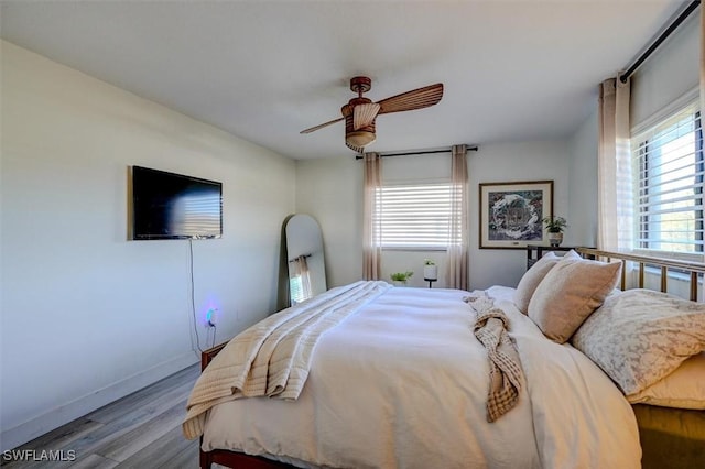 bedroom featuring ceiling fan and light wood-type flooring