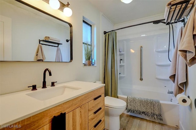 full bathroom featuring vanity, shower / bath combination with curtain, toilet, and wood-type flooring