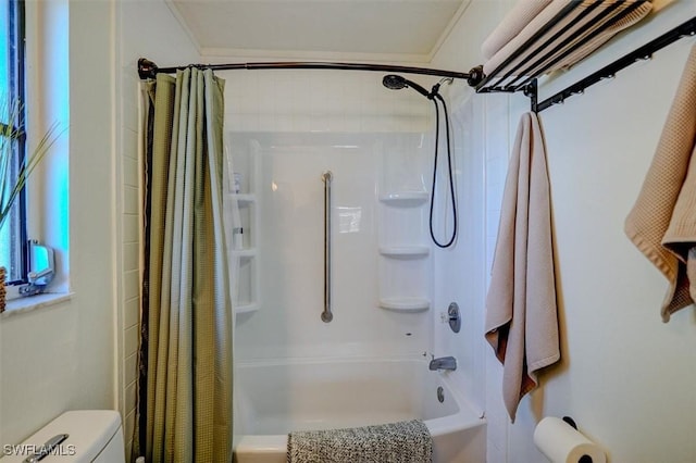 bathroom with ornamental molding, shower / bath combo, and toilet