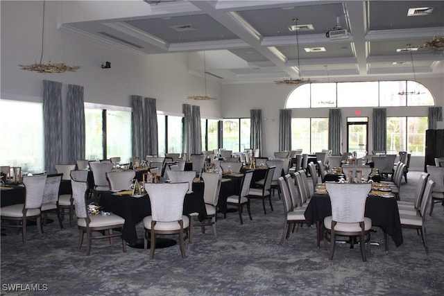 dining room featuring beam ceiling, dark carpet, a towering ceiling, ornamental molding, and coffered ceiling