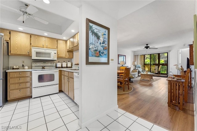 kitchen with ceiling fan, sink, light tile patterned floors, and white appliances