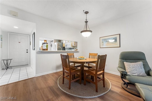 dining room with light hardwood / wood-style flooring