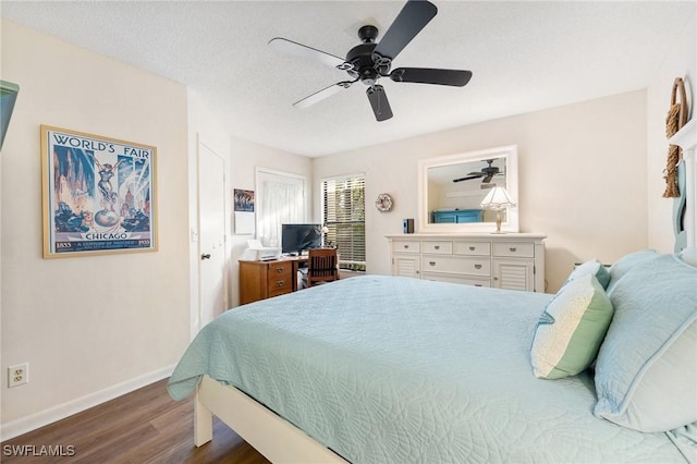 bedroom featuring a textured ceiling, ceiling fan, and dark hardwood / wood-style floors