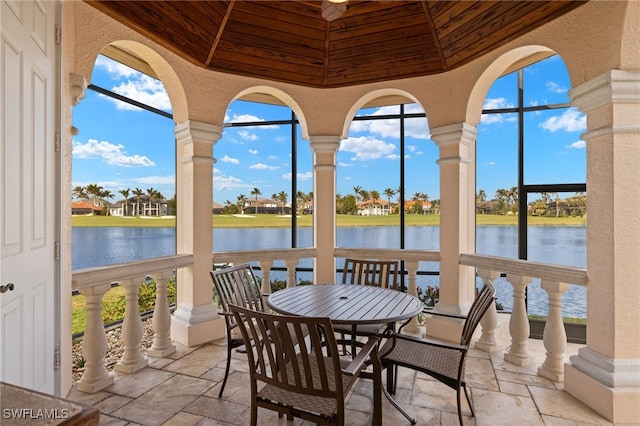 view of patio featuring a water view