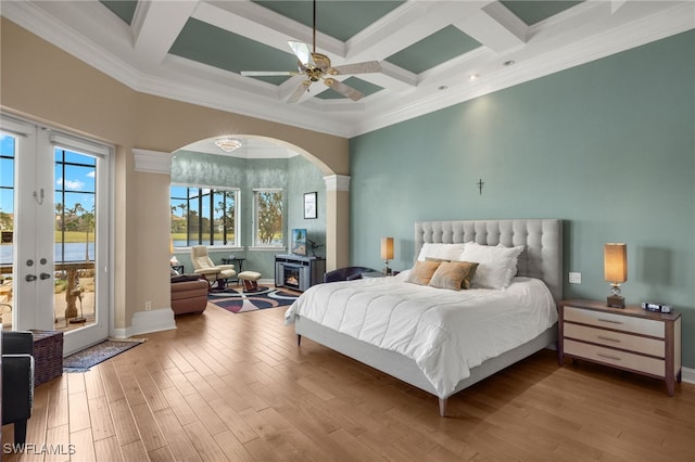 bedroom featuring ornamental molding, access to outside, and coffered ceiling