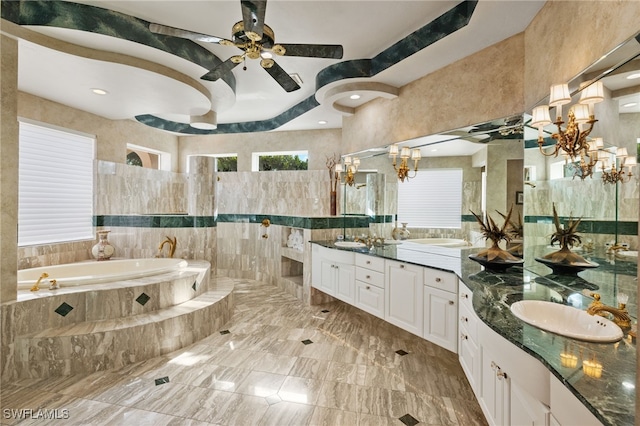 bathroom featuring shower with separate bathtub, vanity, ceiling fan, and tile walls