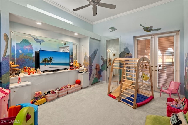 game room featuring carpet floors, ceiling fan, and crown molding