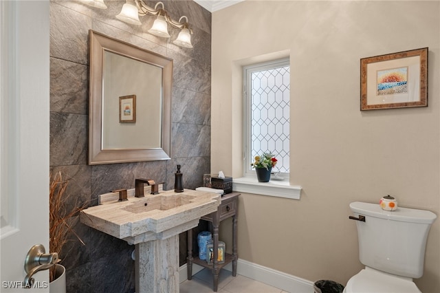 bathroom featuring tile patterned flooring and toilet