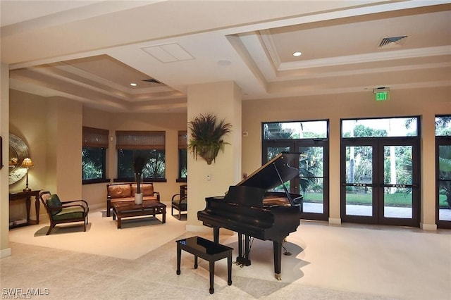 miscellaneous room featuring a tray ceiling, crown molding, and french doors