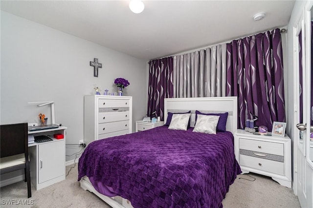 bedroom with light colored carpet