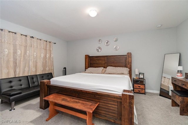 bedroom featuring light carpet