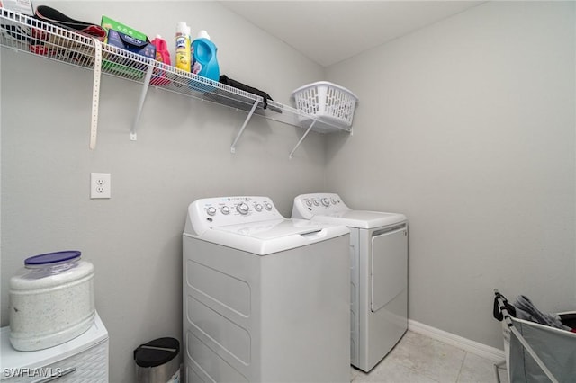 laundry area with washing machine and clothes dryer