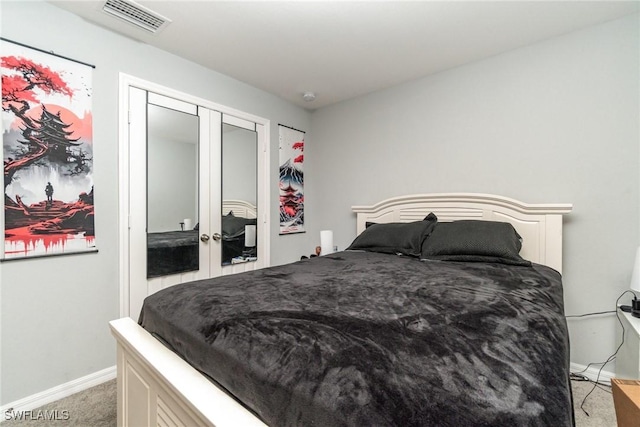 bedroom with light colored carpet, a closet, and french doors