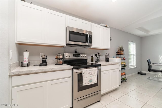 kitchen featuring white cabinetry and stainless steel appliances