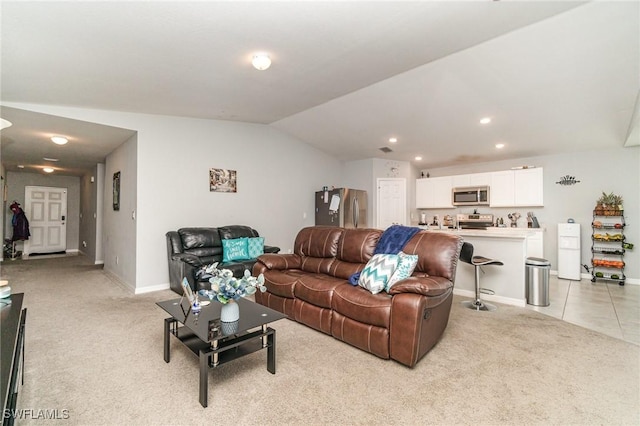 living room with light carpet and vaulted ceiling