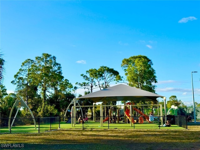 view of playground featuring a lawn