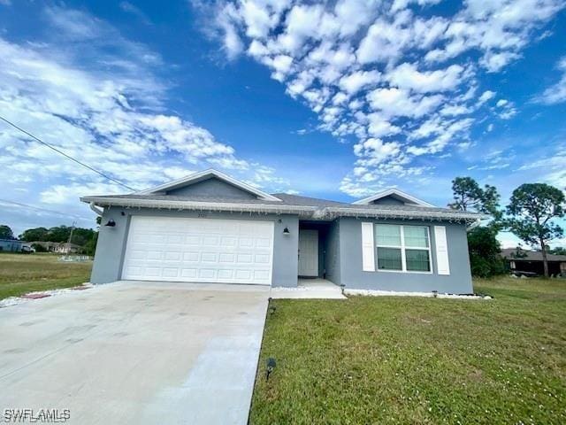 ranch-style home with a garage and a front yard