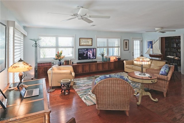 living room featuring ceiling fan and wood-type flooring