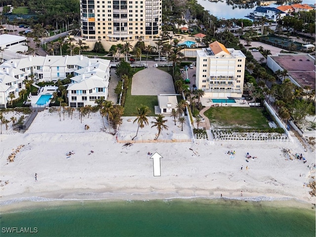 aerial view with a water view and a view of the beach