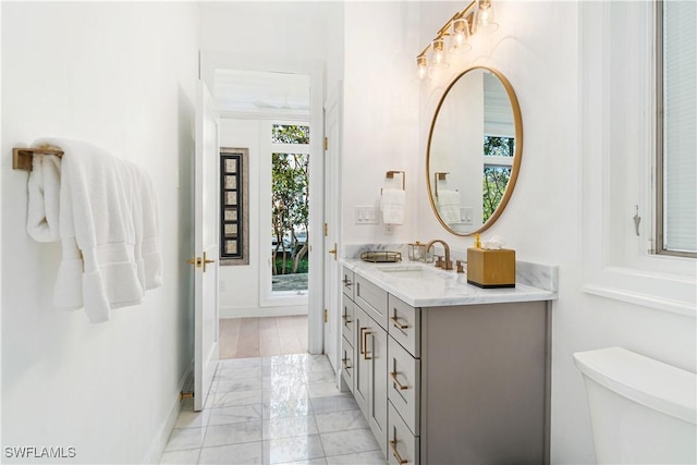 bathroom with vanity and toilet