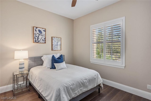 bedroom featuring a ceiling fan, wood finished floors, and baseboards