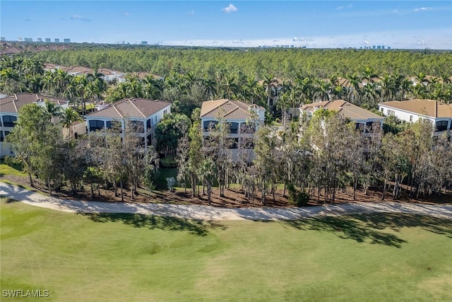 birds eye view of property with a forest view