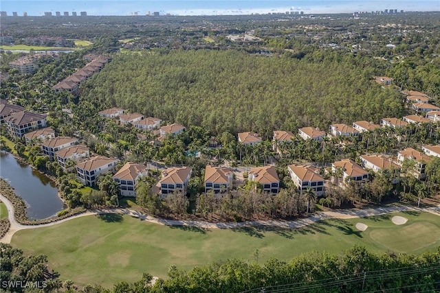 birds eye view of property with a residential view and a water view