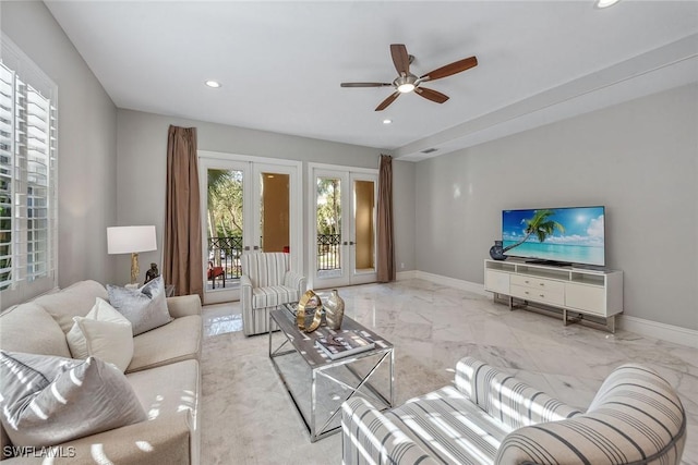 living room with baseboards, recessed lighting, ceiling fan, french doors, and marble finish floor