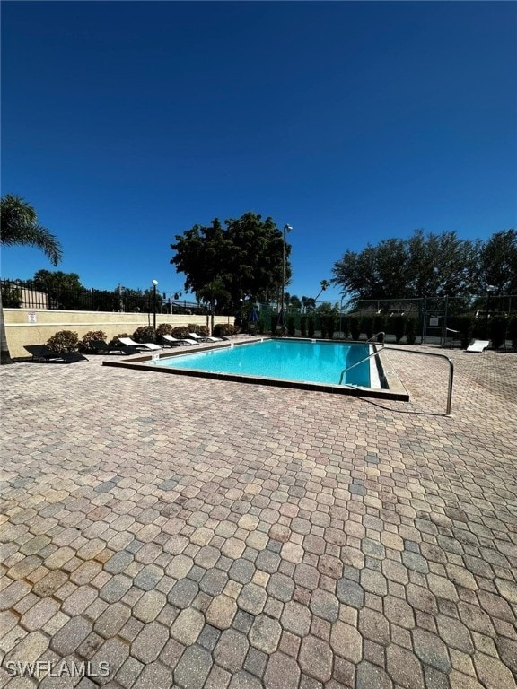 view of swimming pool with a patio