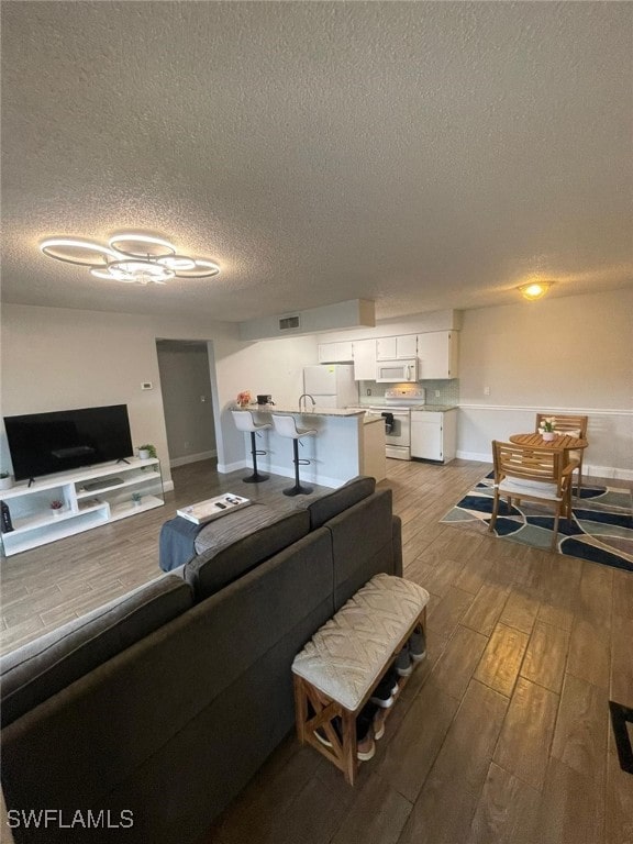 living room with a textured ceiling