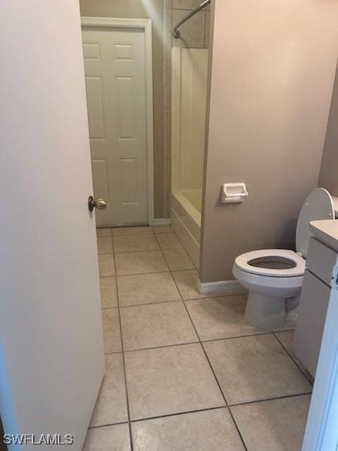 bathroom with tile patterned floors, vanity, and toilet