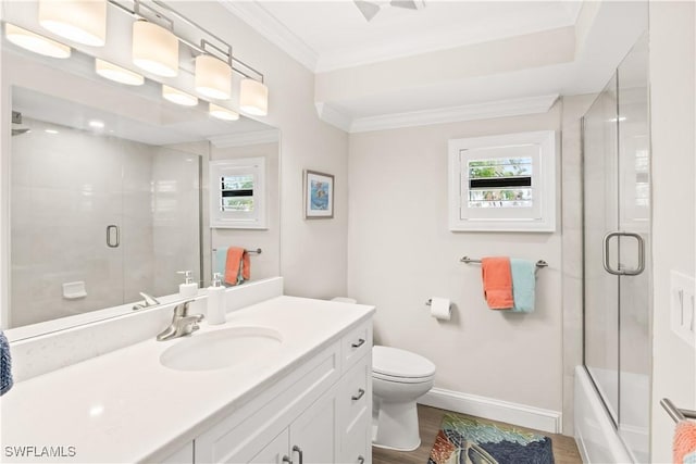 full bathroom featuring vanity, hardwood / wood-style flooring, toilet, and a wealth of natural light