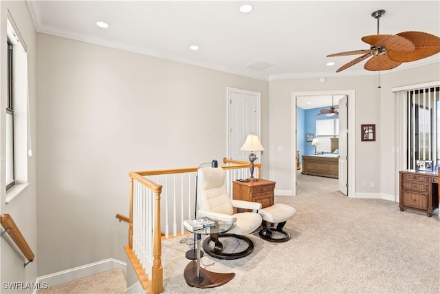 sitting room featuring light carpet and ornamental molding