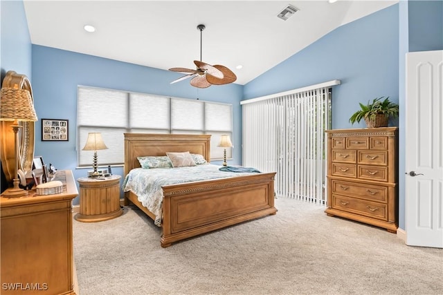 carpeted bedroom featuring ceiling fan and vaulted ceiling