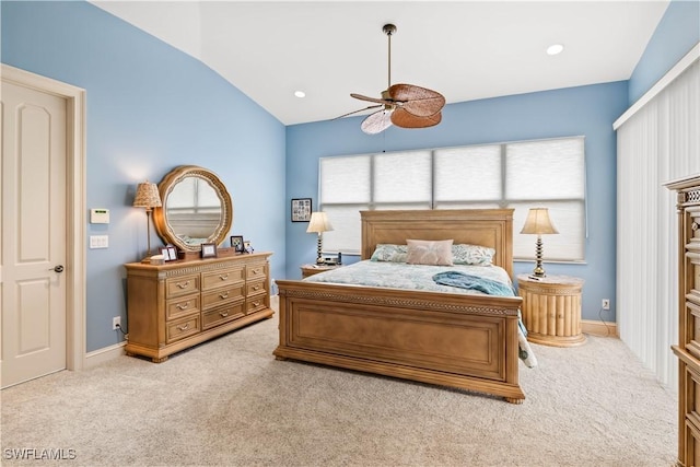 carpeted bedroom with ceiling fan and lofted ceiling