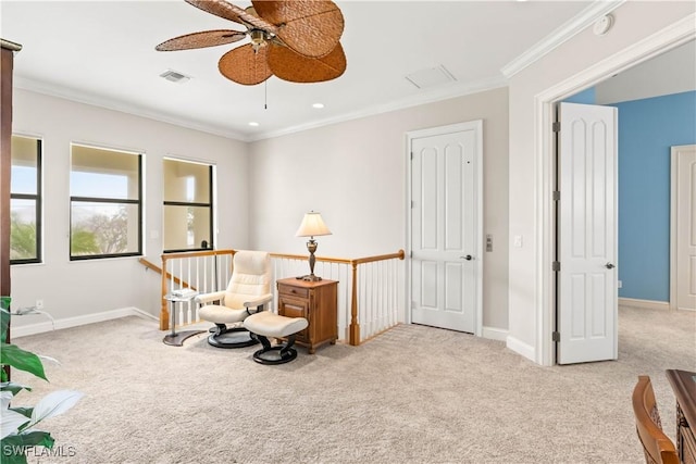 living area featuring crown molding, ceiling fan, and light colored carpet