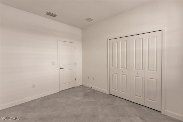 unfurnished bedroom with a closet