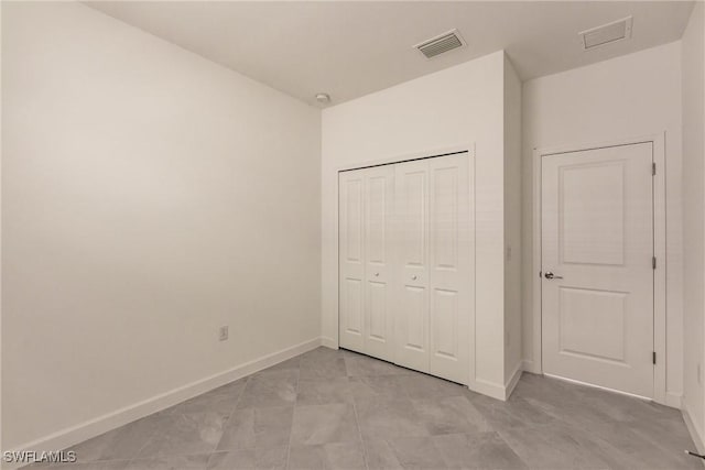 unfurnished bedroom with a closet