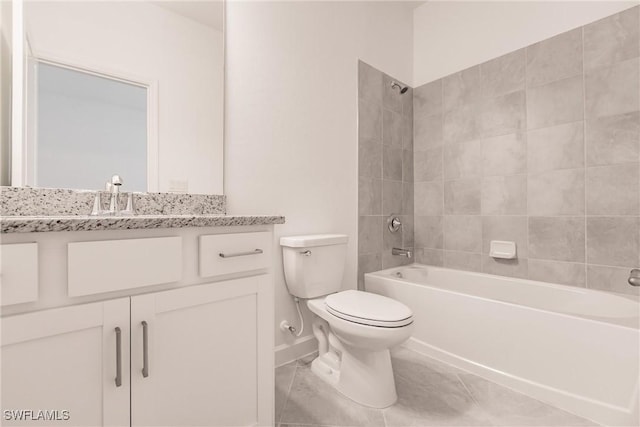 full bathroom featuring tile patterned flooring, vanity, toilet, and tiled shower / bath